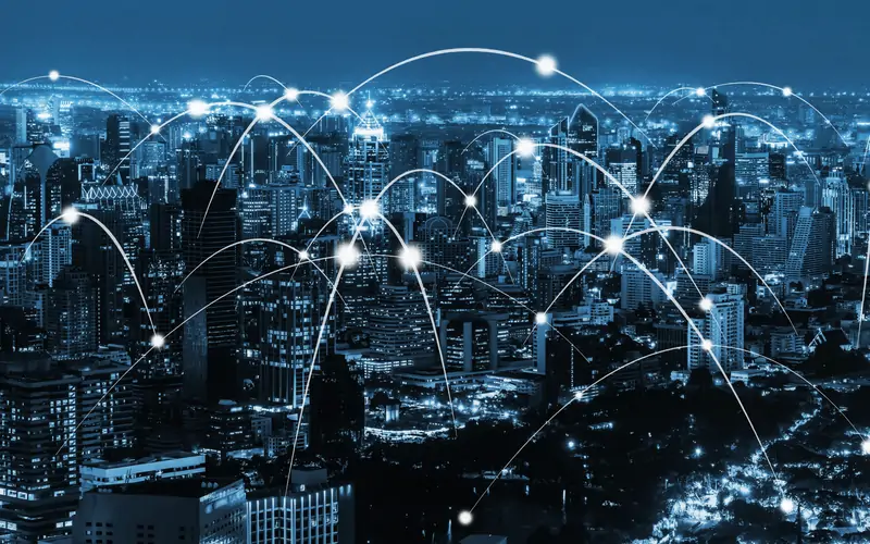A city at night linked by network connections